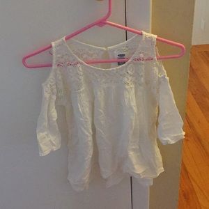 A white, lacy, flowy blouse.